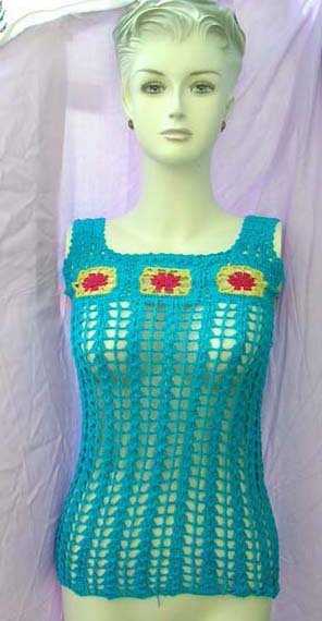 Loose knit crochet tank top with beautifully crafted flower pattern at chest from beach spring retail express b2b import store