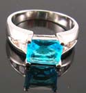 Online cubic zirconia engagement ring jewelry supplier display rhodium ring with aqua cz paired with multi clear cz 