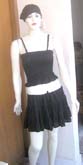 Black tube top matched with a drawstrings mini ruffle skirt